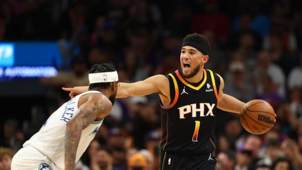Phoenix Suns guard Devin Booker (1) reacts against the Minnesota Timberwolves in the first half at Footprint Center.